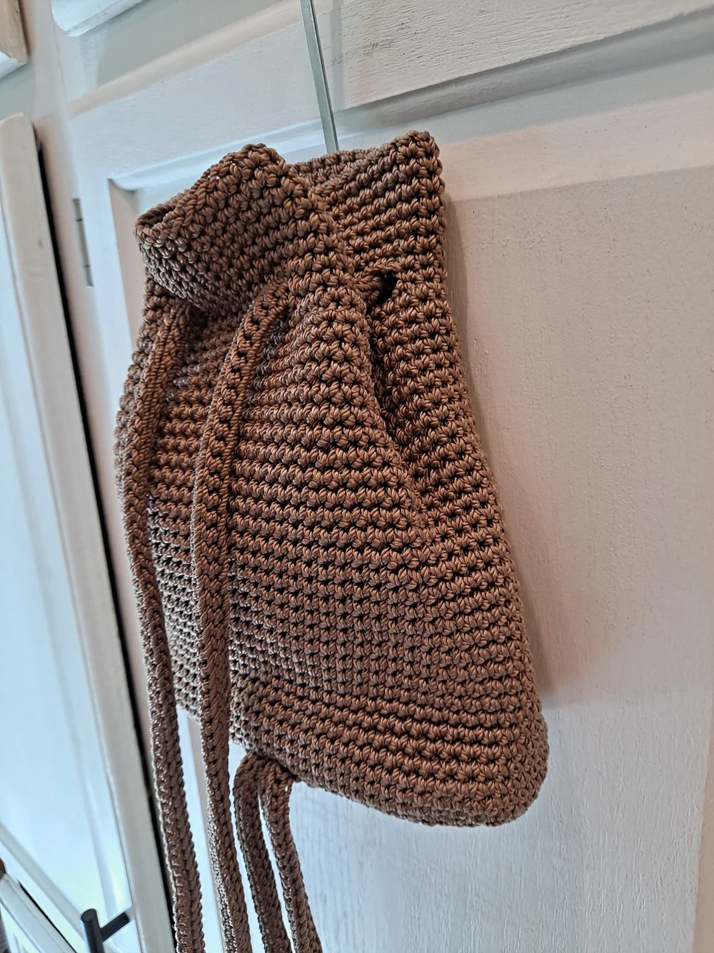 The Sak Brown Crochet Drawstring Mini Backpack